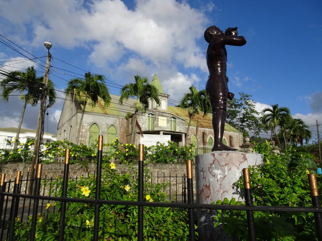 A statue in front of an Anglican Church in Roseau, Dominica