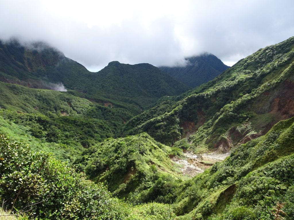 A view of mountains overgrown with lush vegetation in Morne Trois Pitons National Park, Dominica