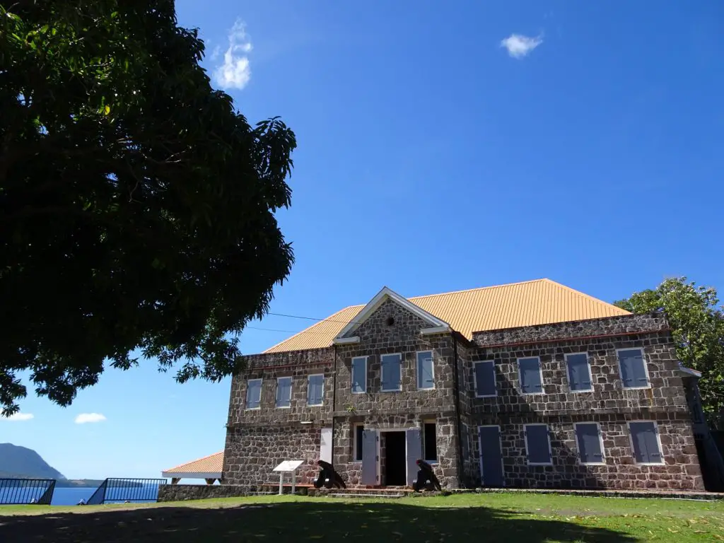 A reconstructed fort building near the ocean, at Fort Shirley near Portsmouth, Dominica