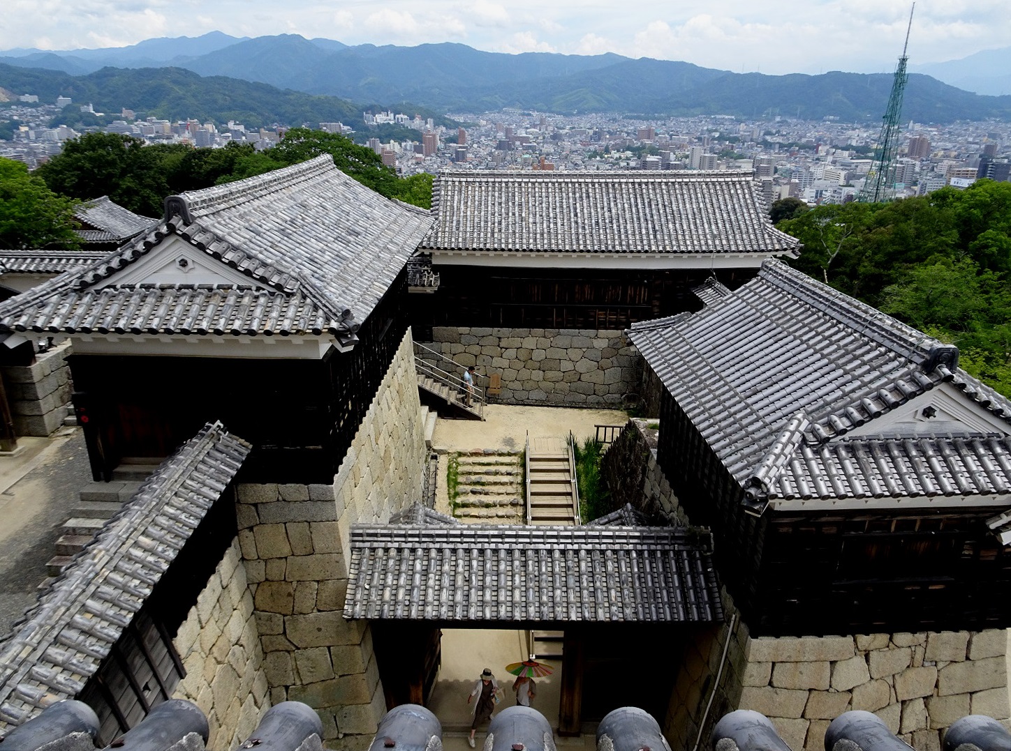 View of a modern city from a historical wooden castle
