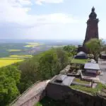 A huge sandstone monument towering over a plain