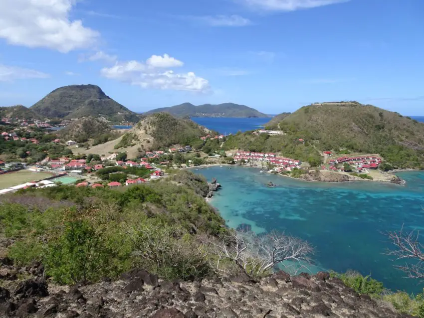A view of small villages in a bay on an island in a tropical sea
