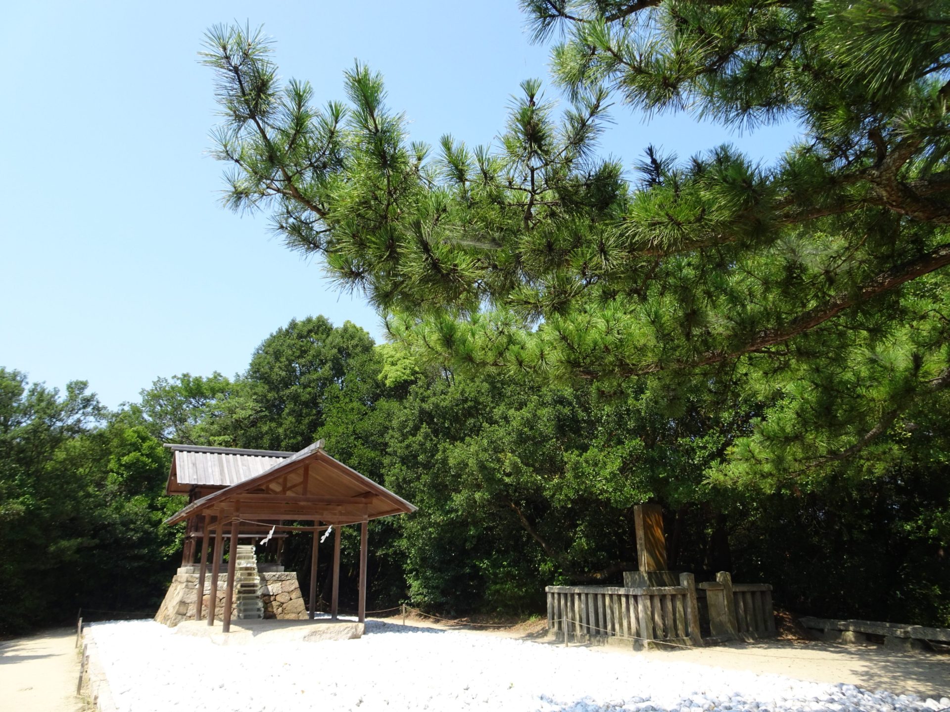 A small wooden shrine under trees