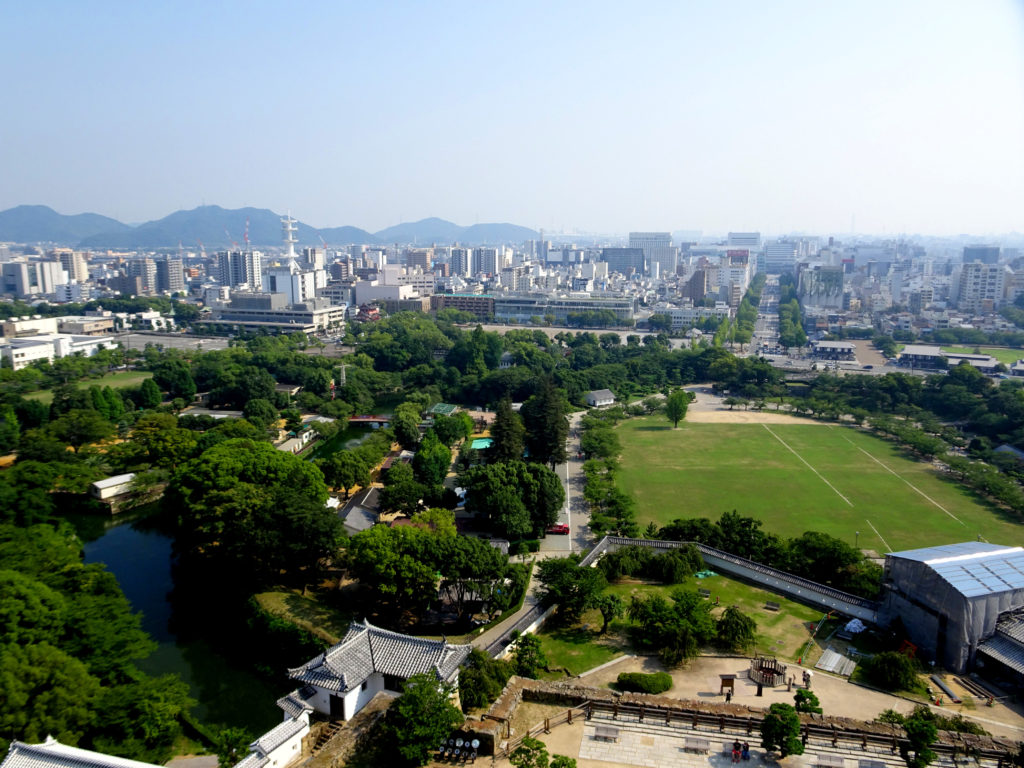 A distant city seen over a garden