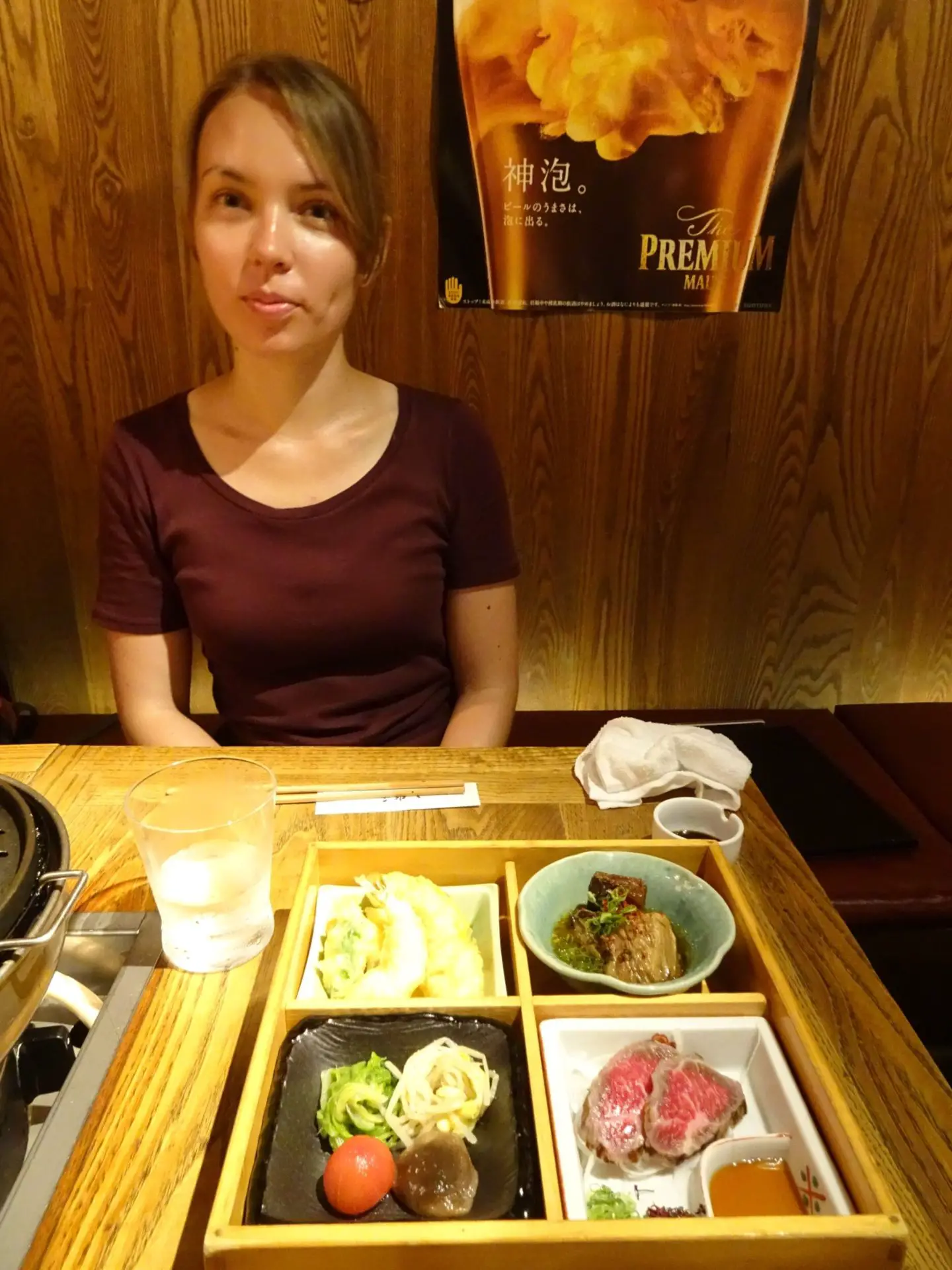 A girl sitting in front of a plate Kobe Beef