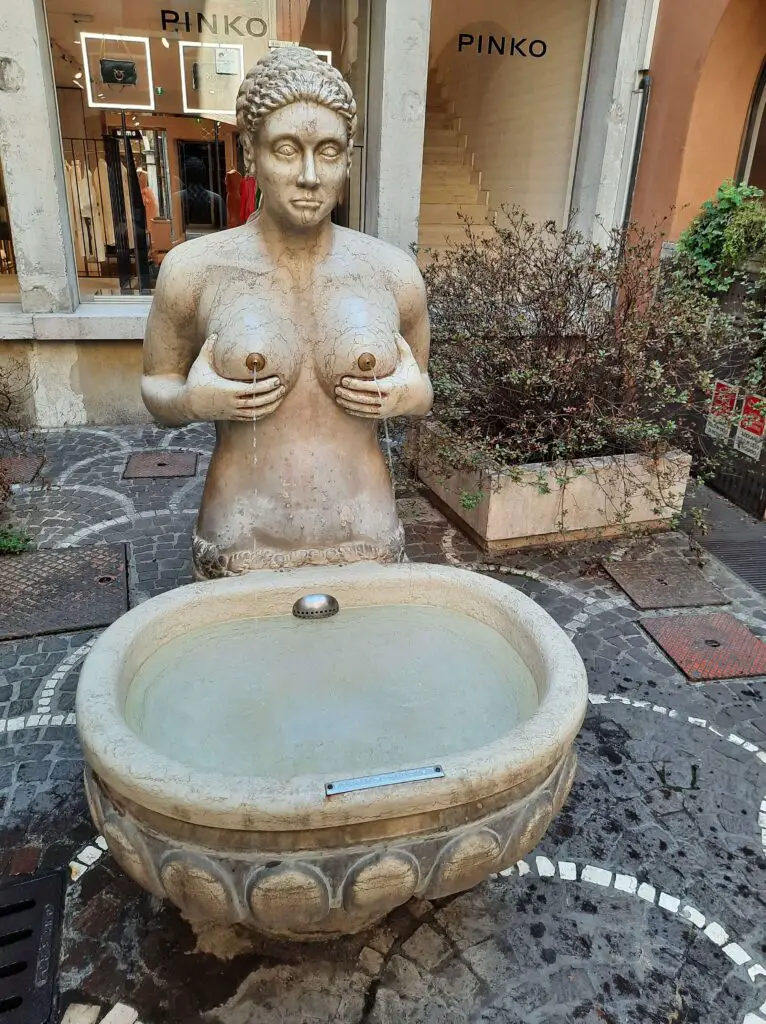 A fountain of a woman sprouting water from her breasts
