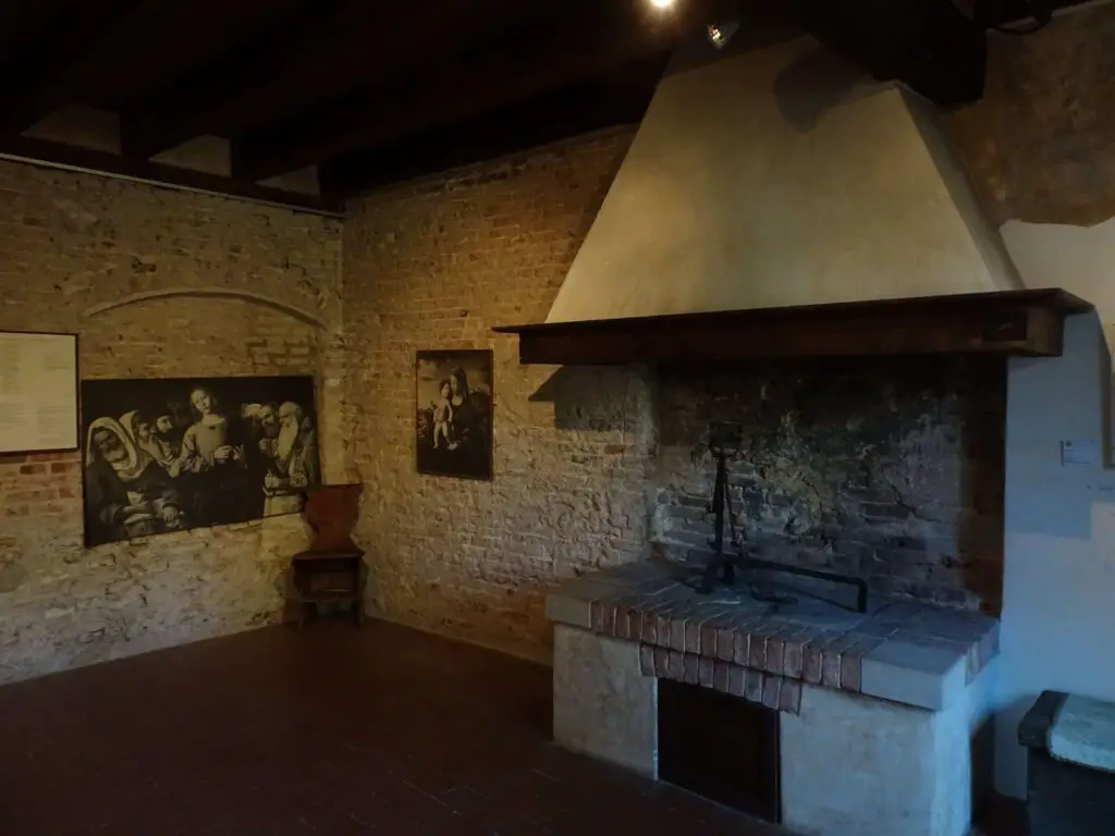 A medieval libing quarter with a big fireplace