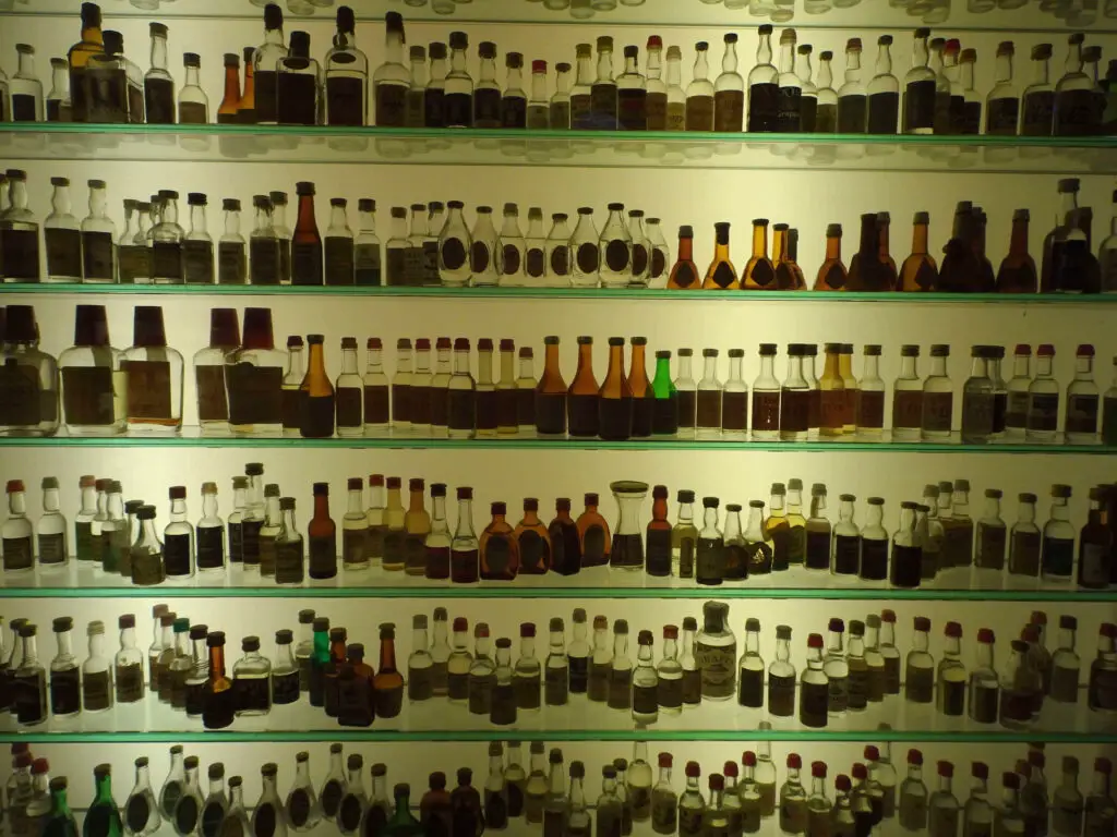 A glass display full of small liquor bottles