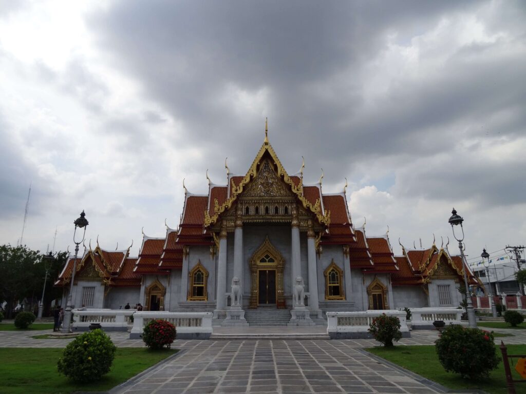 A palace like marble building with a many-gabled roof