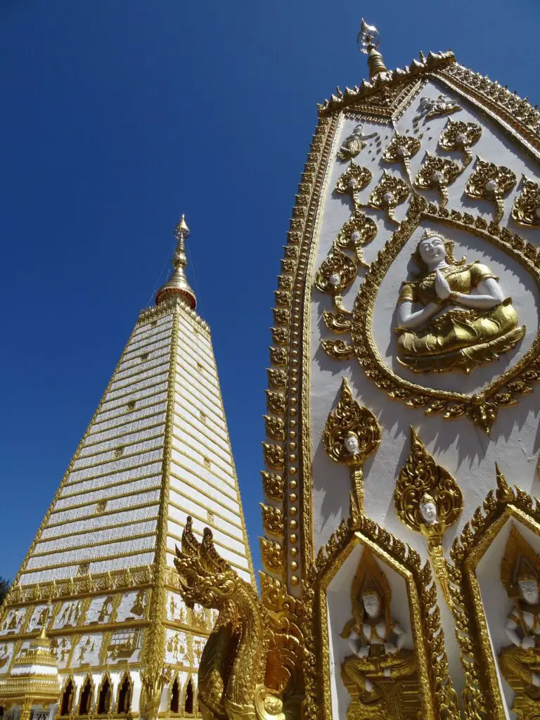 Two white-and-gold temple towers