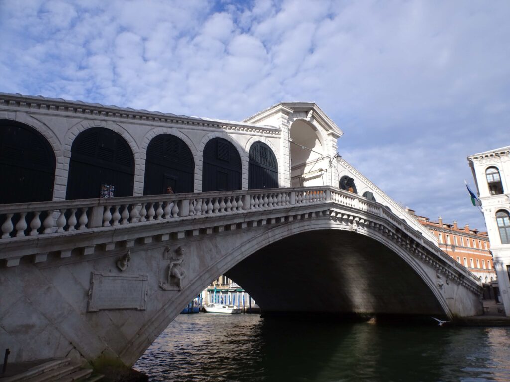 A magnificent covered bridge crossing a canal