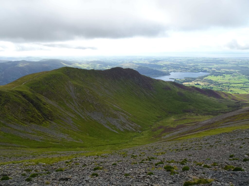 A view across a plain with a mountain in the foreground