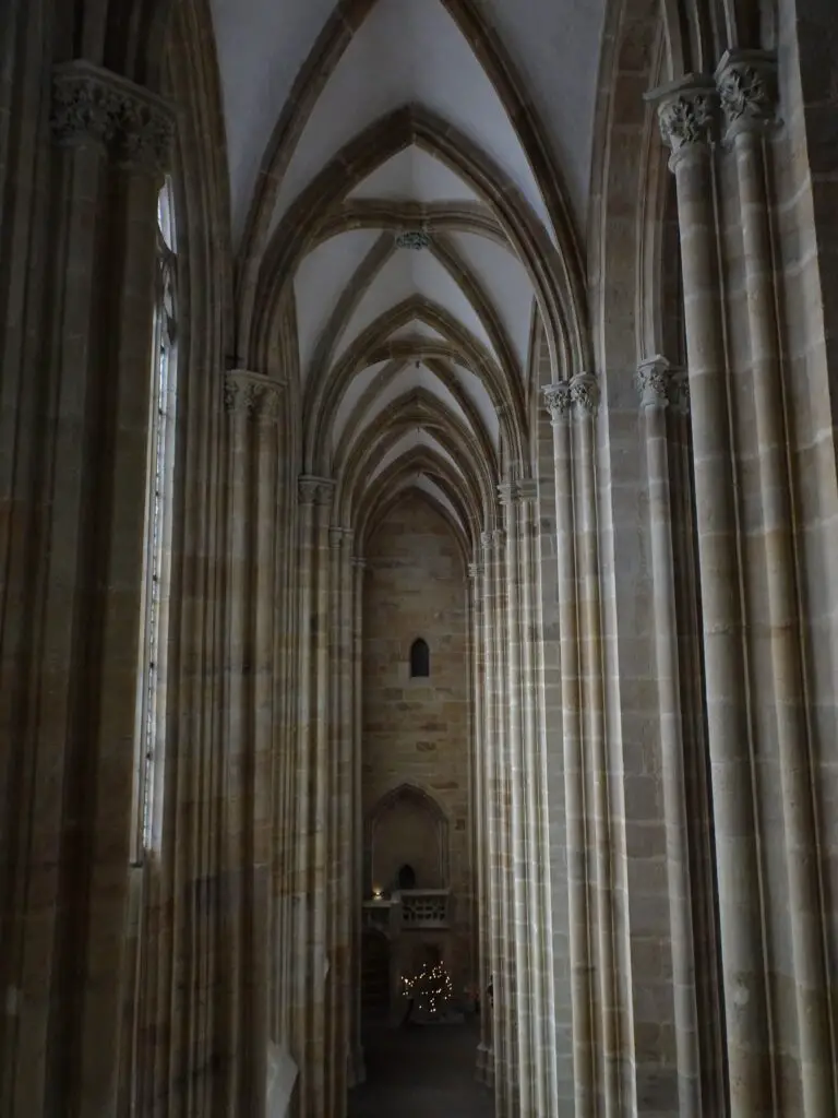 Tall stone pillars in the nave of a gothic-era cathedral