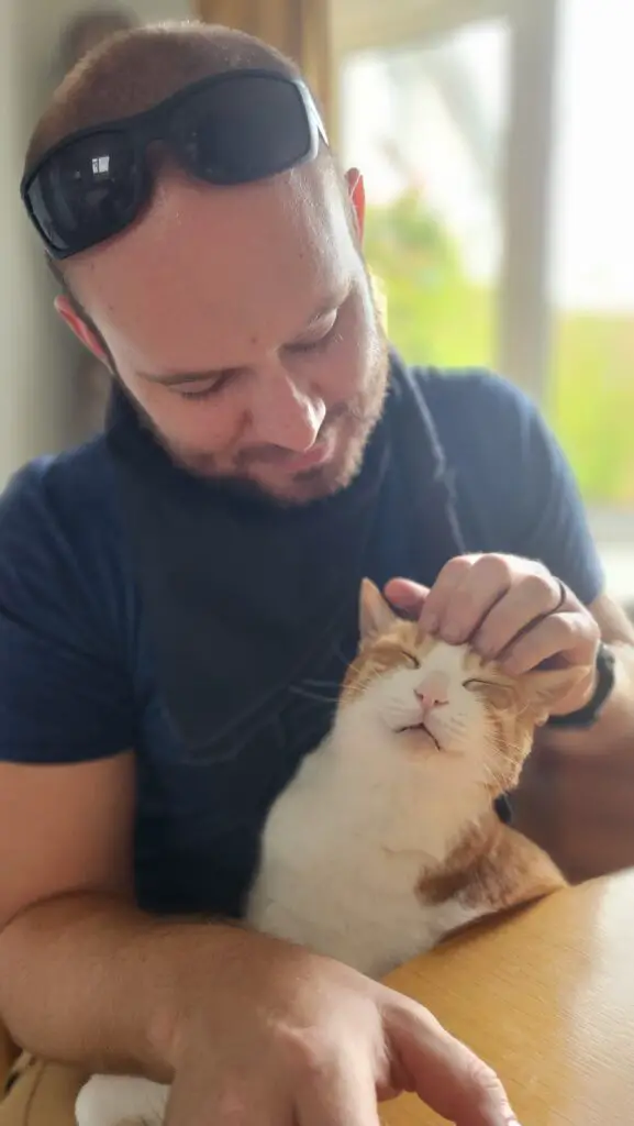 A man petting a cat