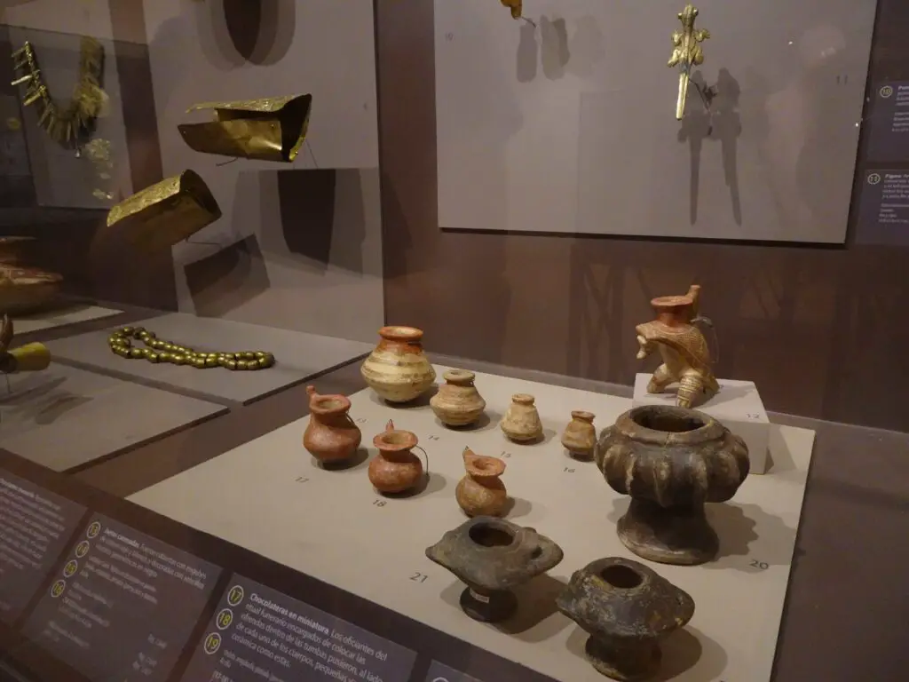 A museum display containing several pottery vessels