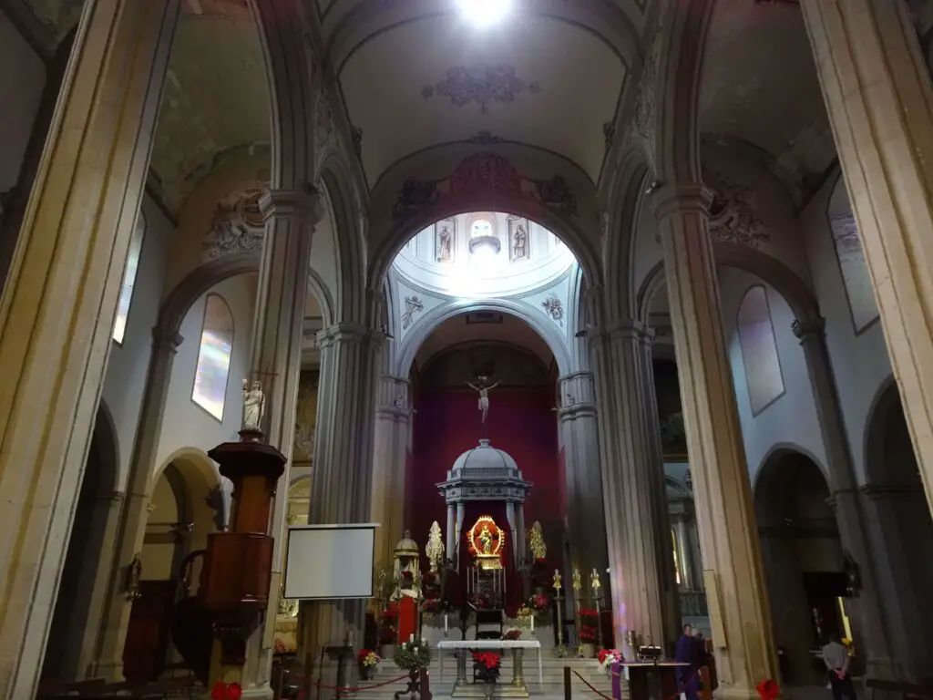 The interior of a church with tall, slender pillars