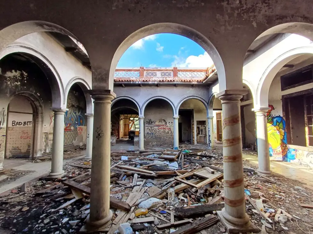 An arcaded patio in an abandoned villa