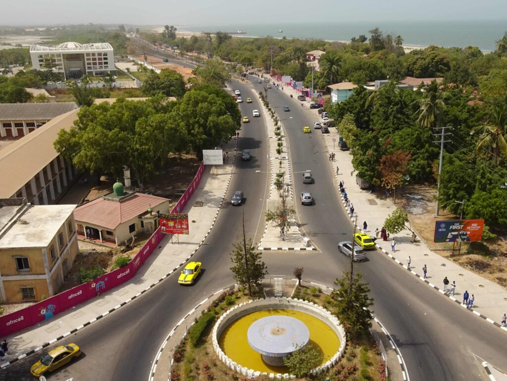 A roundabout and broad avenue by the Ocean