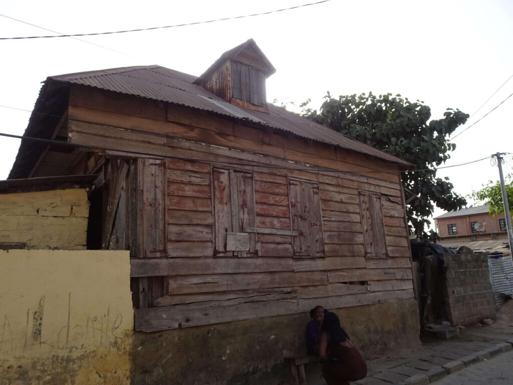 An old wooden house in an alleyway