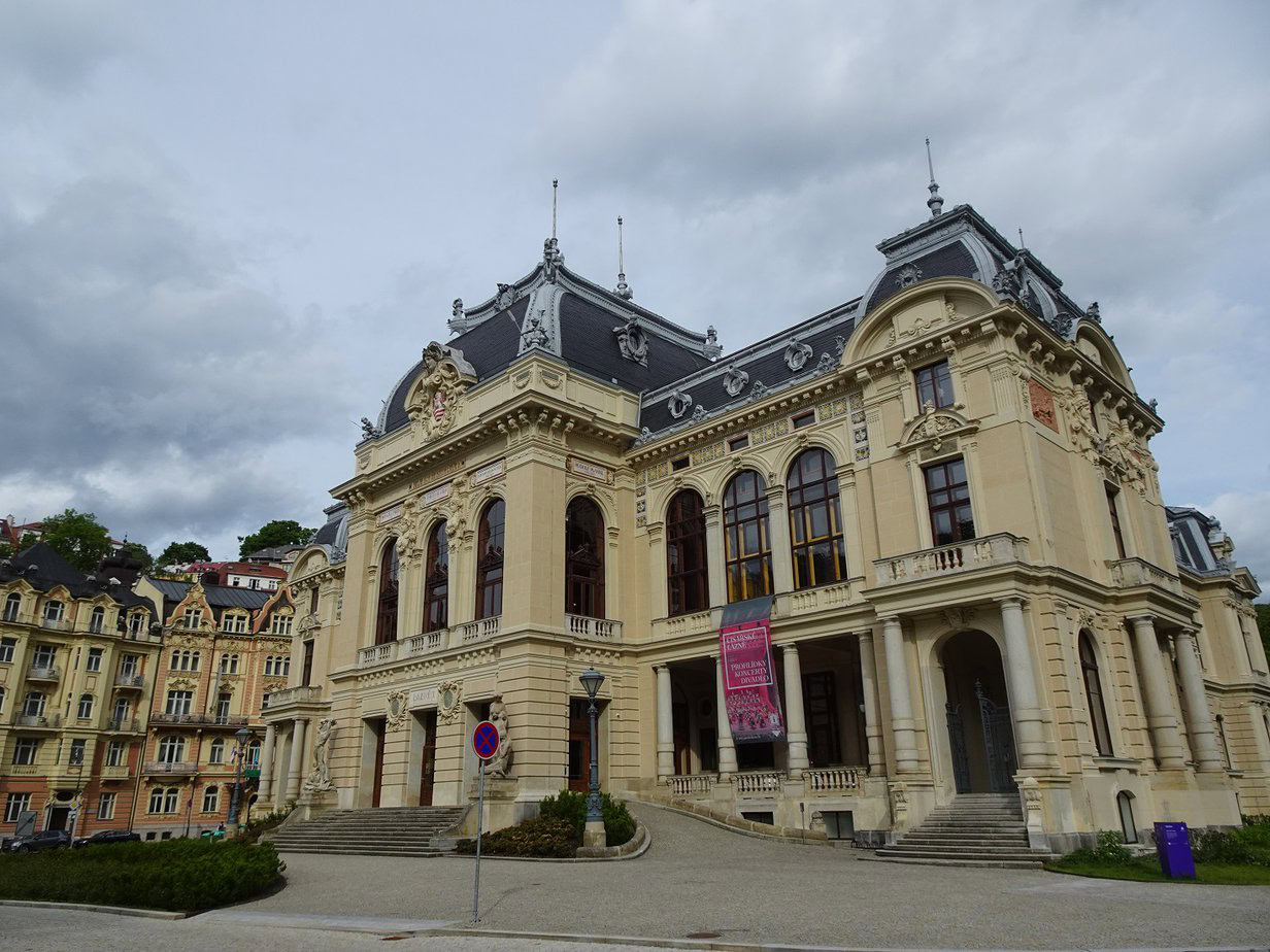 A grand 19th-century bath building fronted by a small square