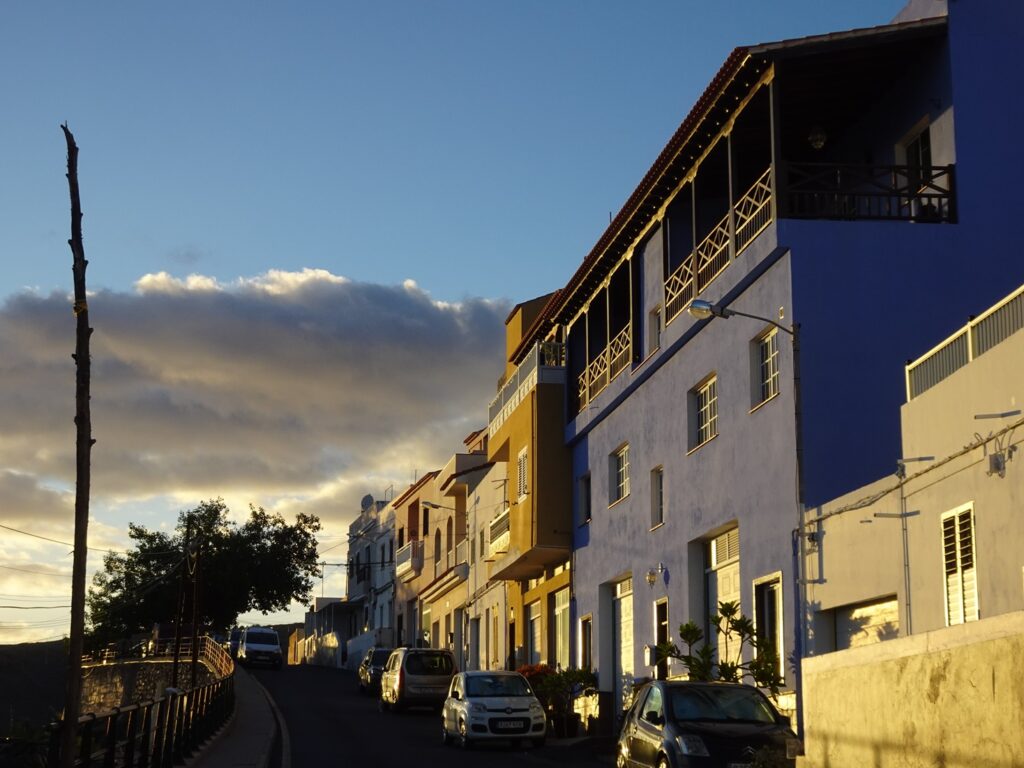 A row of colourful houses at dusk