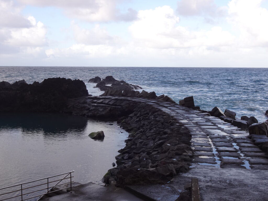 A pier on a rocky shore by the sea